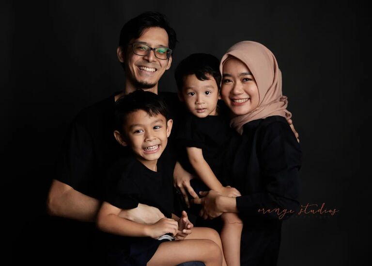 family having fun and giggle in the photo studio