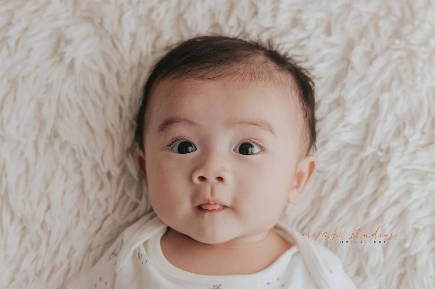 Image of a baby with a happy expression