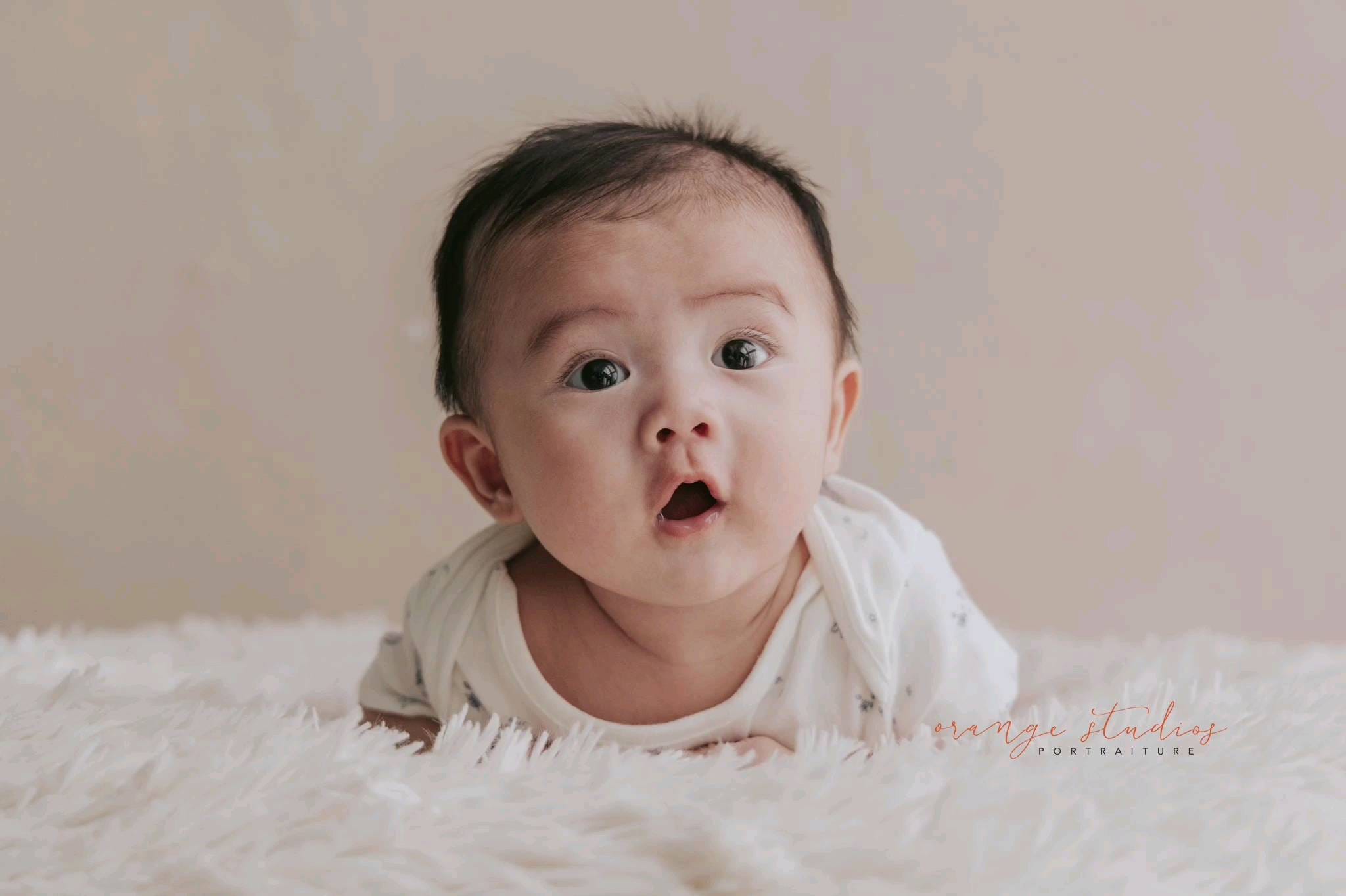 Baby milestone portrait at Orange Studios Singapore, styled for a traditional Chinese family celebration