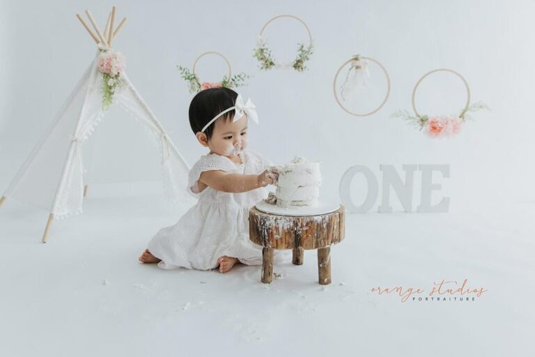 Baby smashing cake at Orange Studios Singapore – first birthday shoot