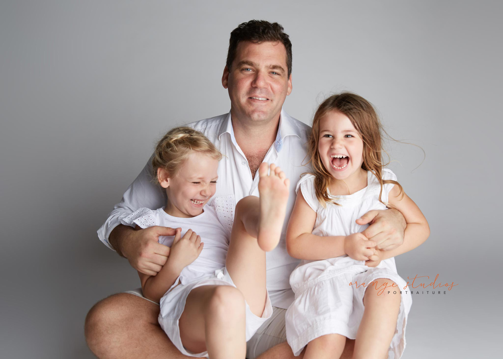 dad and daughters fun portraits in singapore photo studio