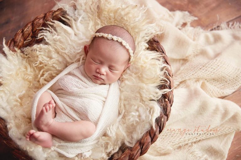 15 days old baby girl in basket newborn portraits in singapore studio