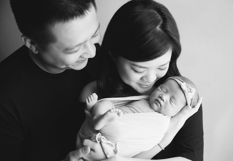 15 days old baby girl black and white newborn portraits with parents in singapore studio