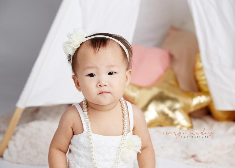 one year old baby girl cake smash portraits in singapore studio