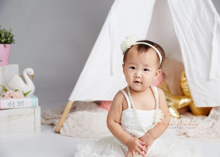 one year old baby girl cake smash portraits in singapore studio