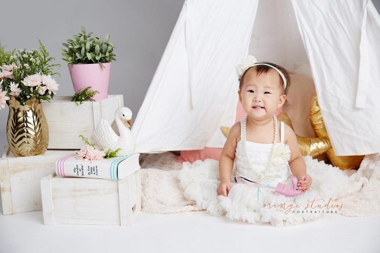 one year old baby girl cake smash portraits in singapore studio
