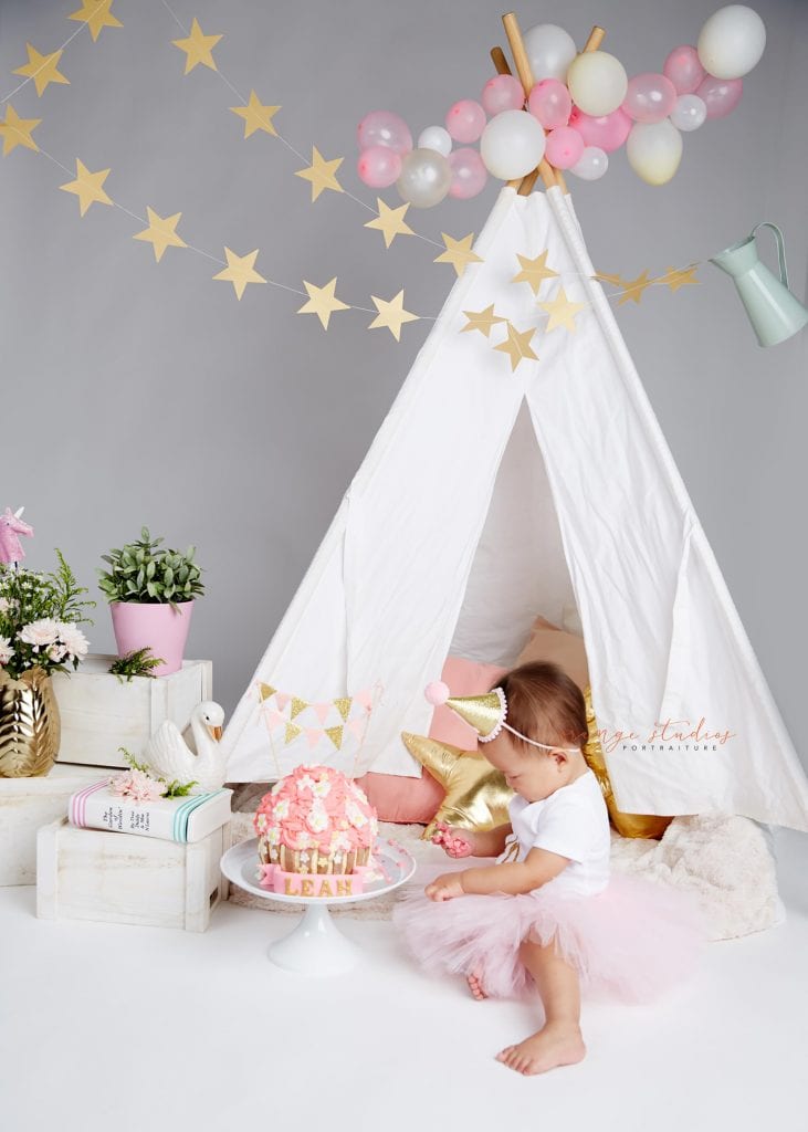 one year old baby girl cake smash portraits in singapore studio