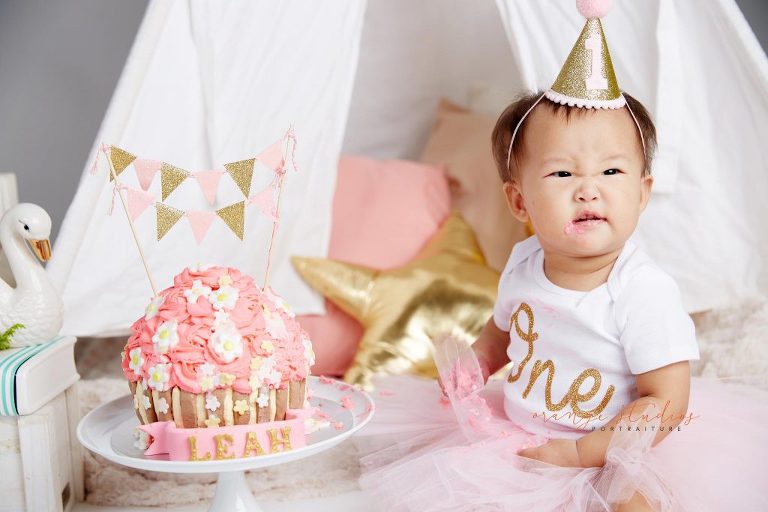 one year old baby girl cake smash portraits in singapore studio