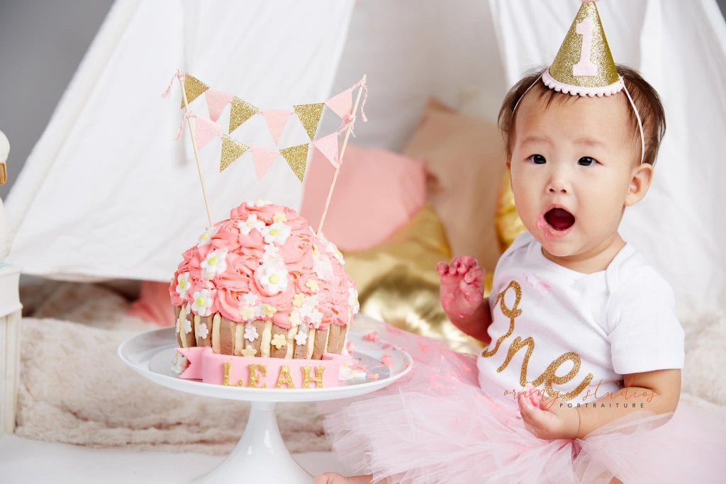 one year old baby girl cake smash portraits in singapore studio