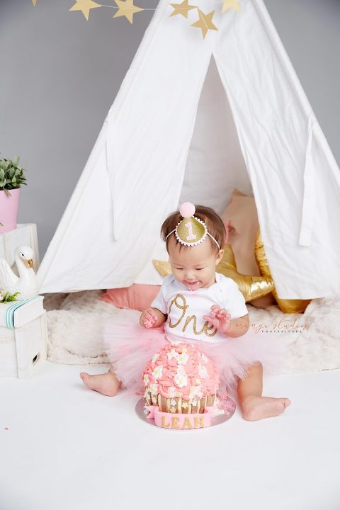 one year old baby girl cake smash portraits in singapore studio