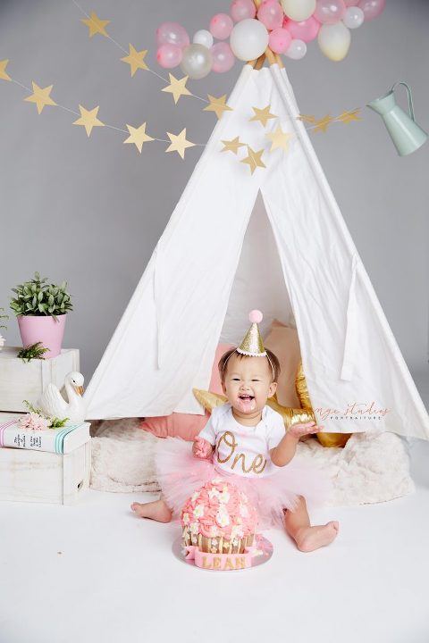 one year old baby girl cake smash portraits in singapore studio