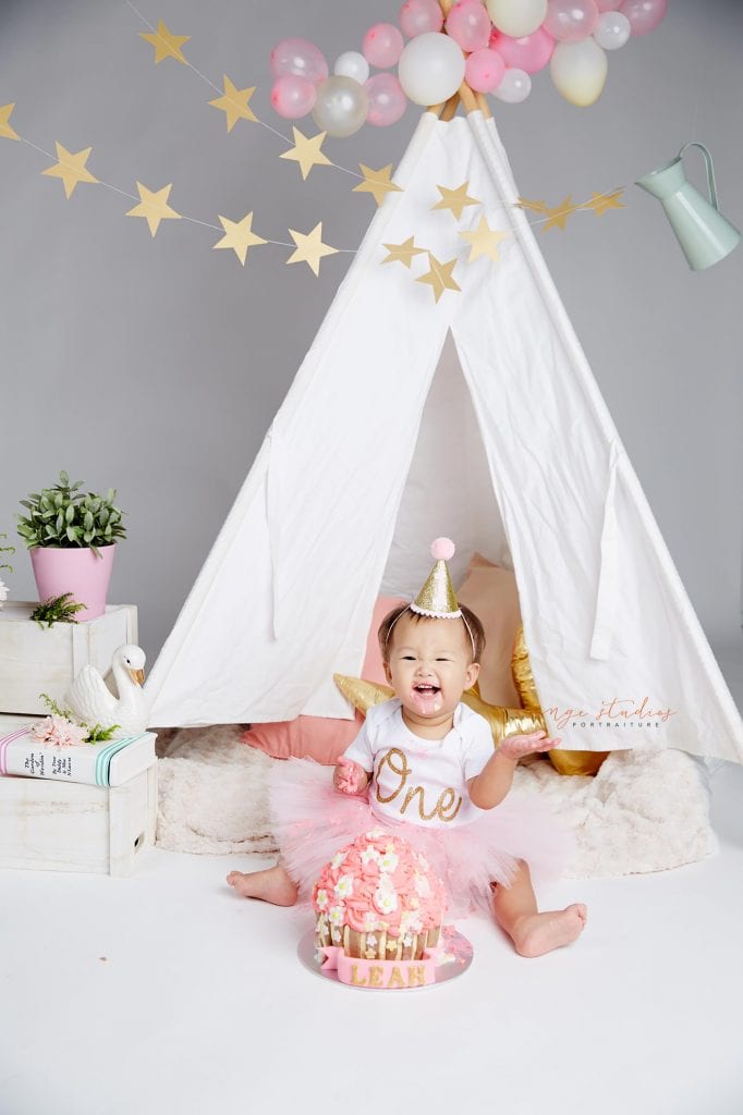 one year old baby girl cake smash portraits in singapore studio