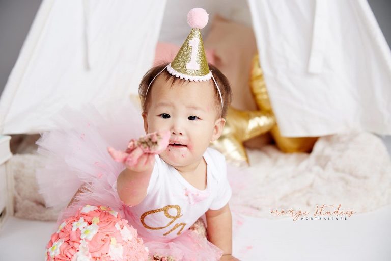 one year old baby girl cake smash portraits in singapore studio