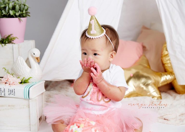 one year old baby girl cake smash portraits in singapore studio