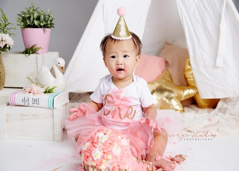 one year old baby girl cake smash portraits in singapore studio