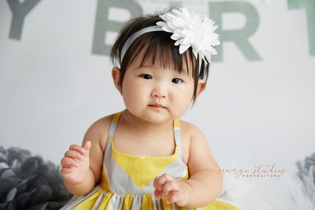 one year old baby girl cake smash portraits in singapore studio