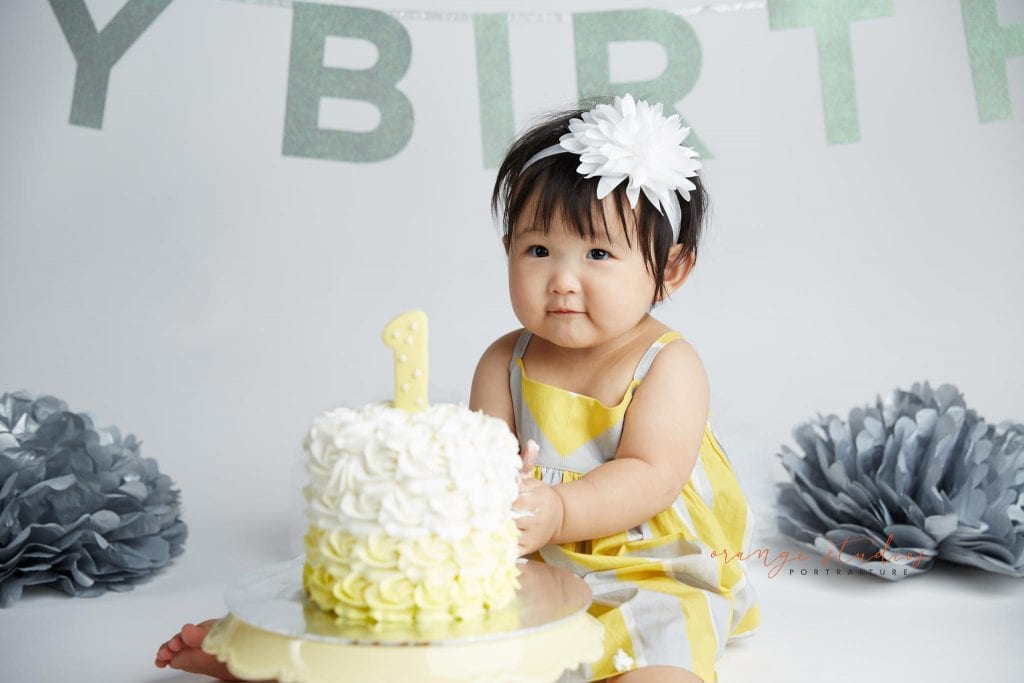 one year old baby girl cake smash portraits in singapore studio
