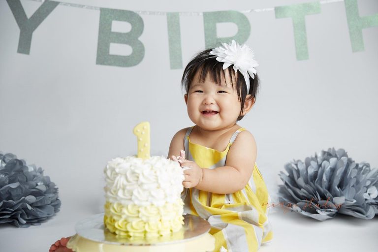 one year old baby girl cake smash portraits in singapore studio