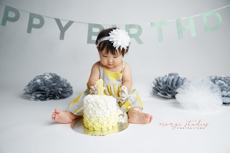 one year old baby girl cake smash portraits in singapore studio