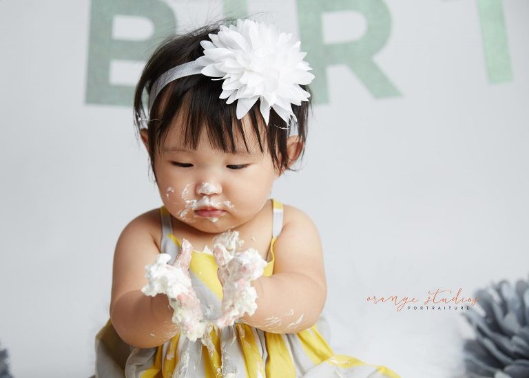 one year old baby girl cake smash portraits in singapore studio