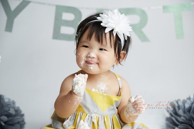 one year old baby girl cake smash portraits in singapore studio