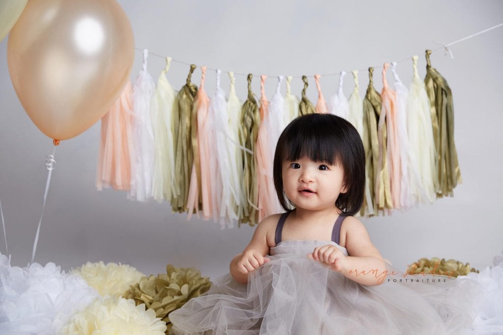one year old baby girl cake smash portraits in singapore studio