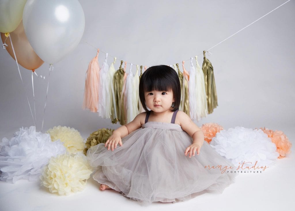 one year old baby girl cake smash portraits in singapore studio