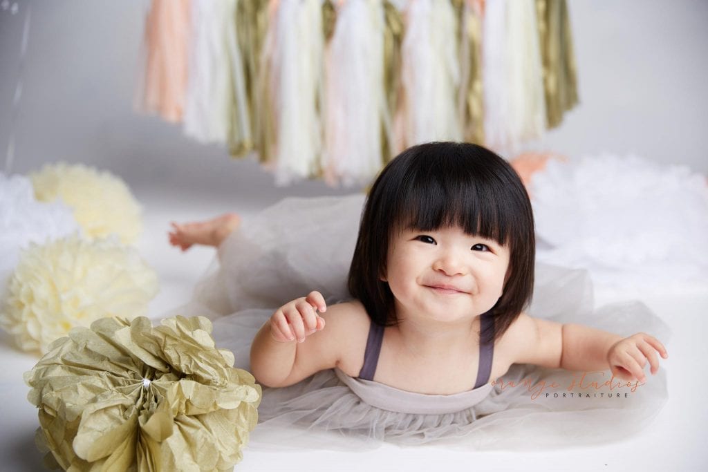 one year old baby girl cake smash portraits in singapore studio