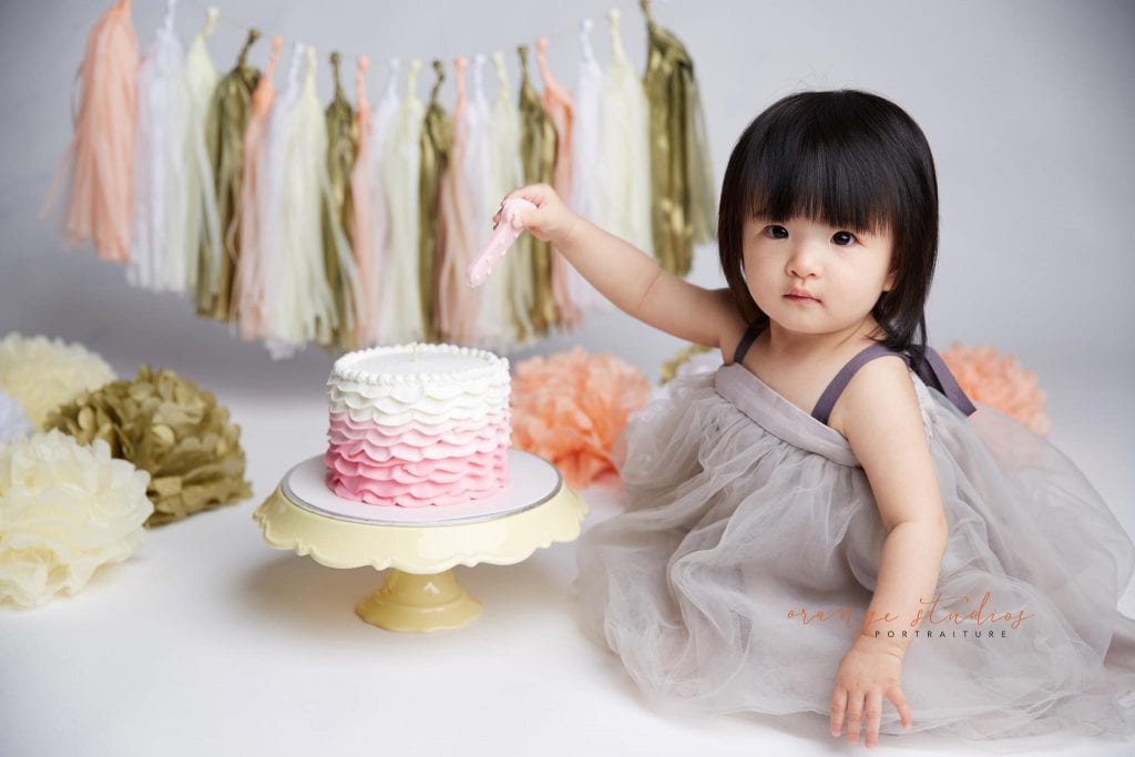 one year old baby girl cake smash portraits in singapore studio
