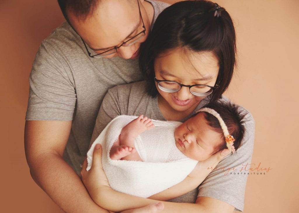 13 days old baby girl newborn portraits with parents in singapore studio