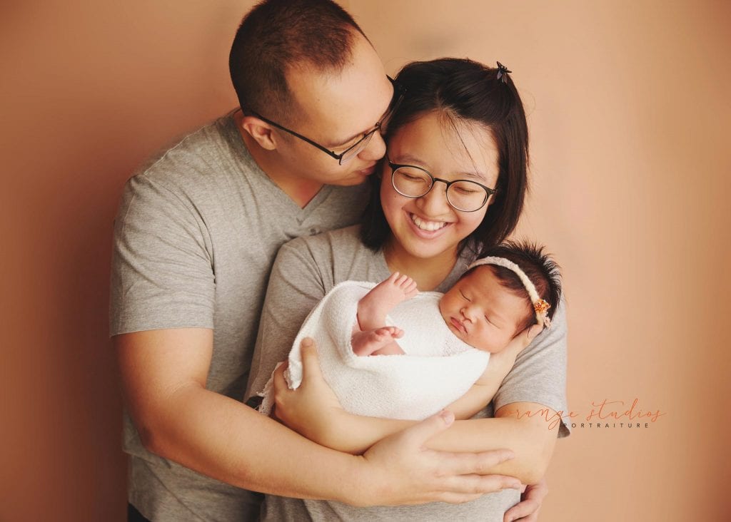 13 days old baby girl newborn portraits with parents in singapore studio