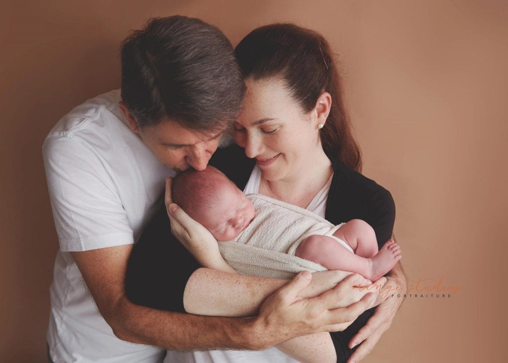 11 days old baby boy newborn portraits with parents in singapore studio