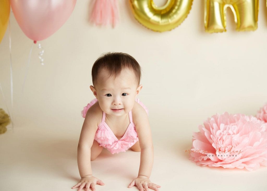 one year old baby girl cake smash portraits in singapore studio