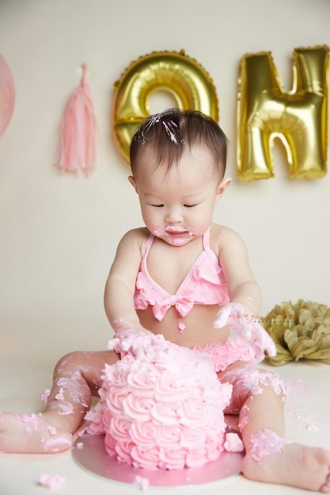one year old baby girl cake smash portraits in singapore studio