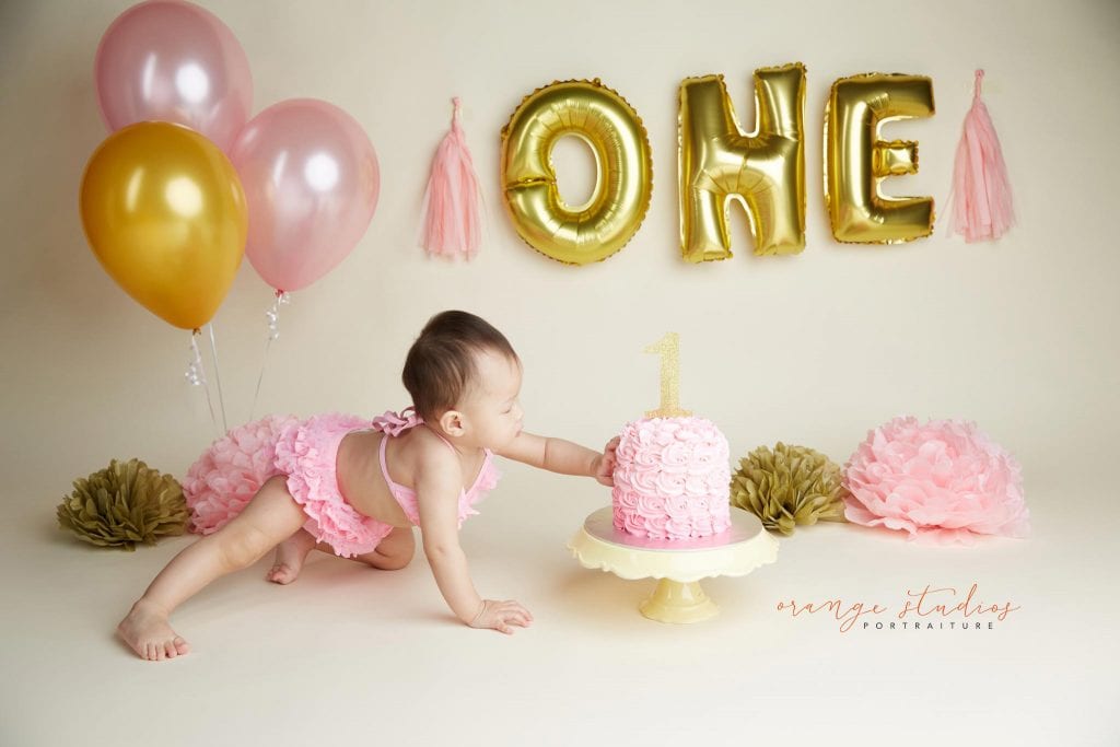 one year old baby girl cake smash portraits in singapore studio