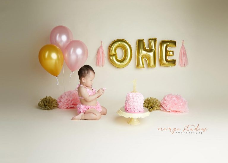 one year old baby girl cake smash portraits in singapore studio