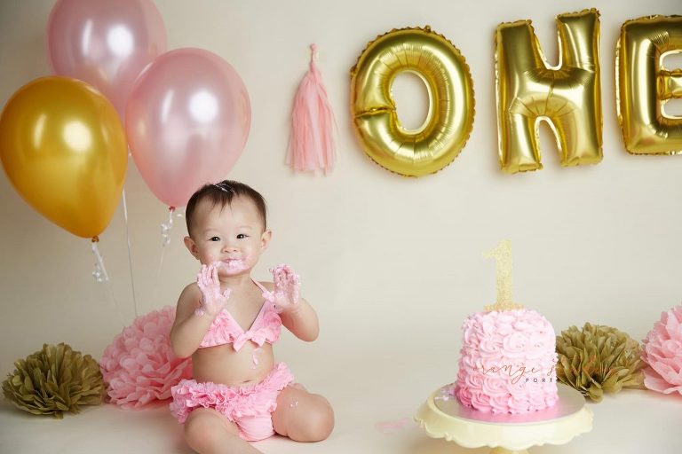 one year old baby girl cake smash portraits in singapore studio