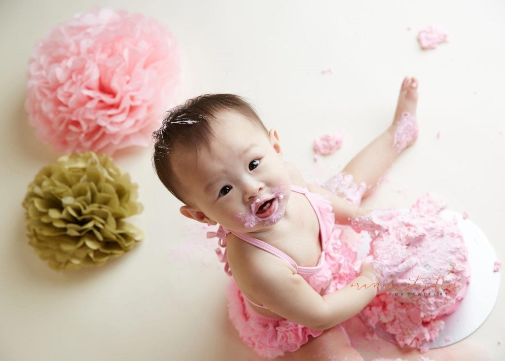 one year old baby girl cake smash portraits in singapore studio
