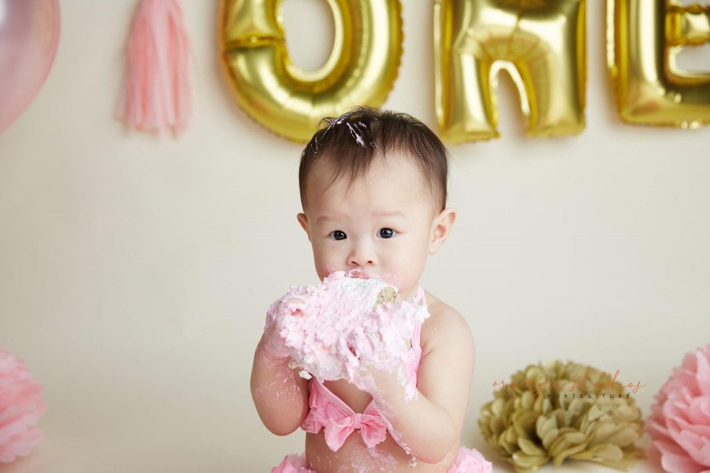 one year old baby girl cake smash portraits in singapore studio