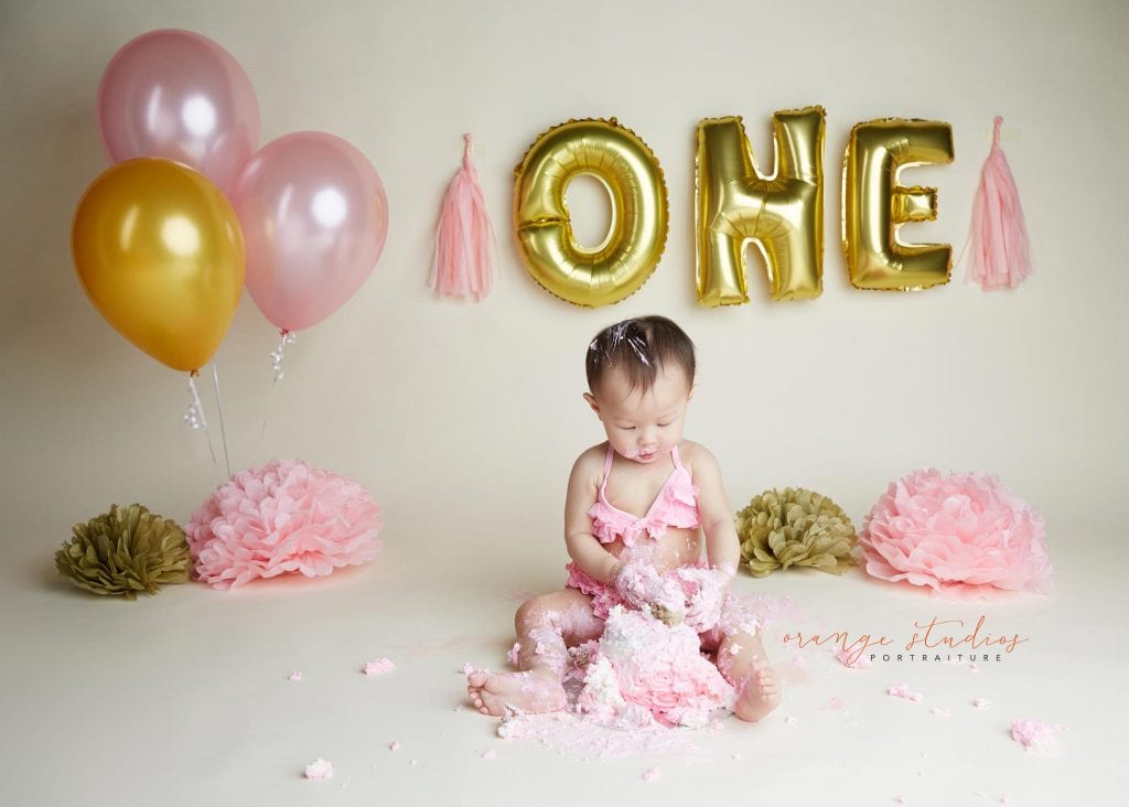 one year old baby girl cake smash portraits in singapore studio