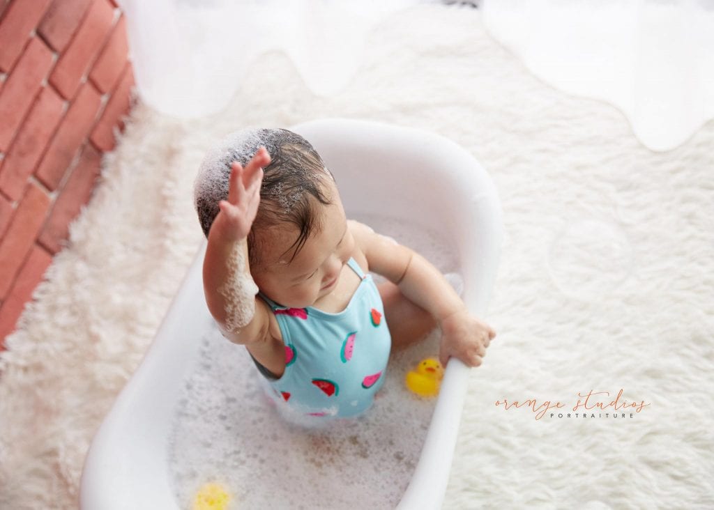 one year old baby girl cake smash bubble bath portraits in singapore studio