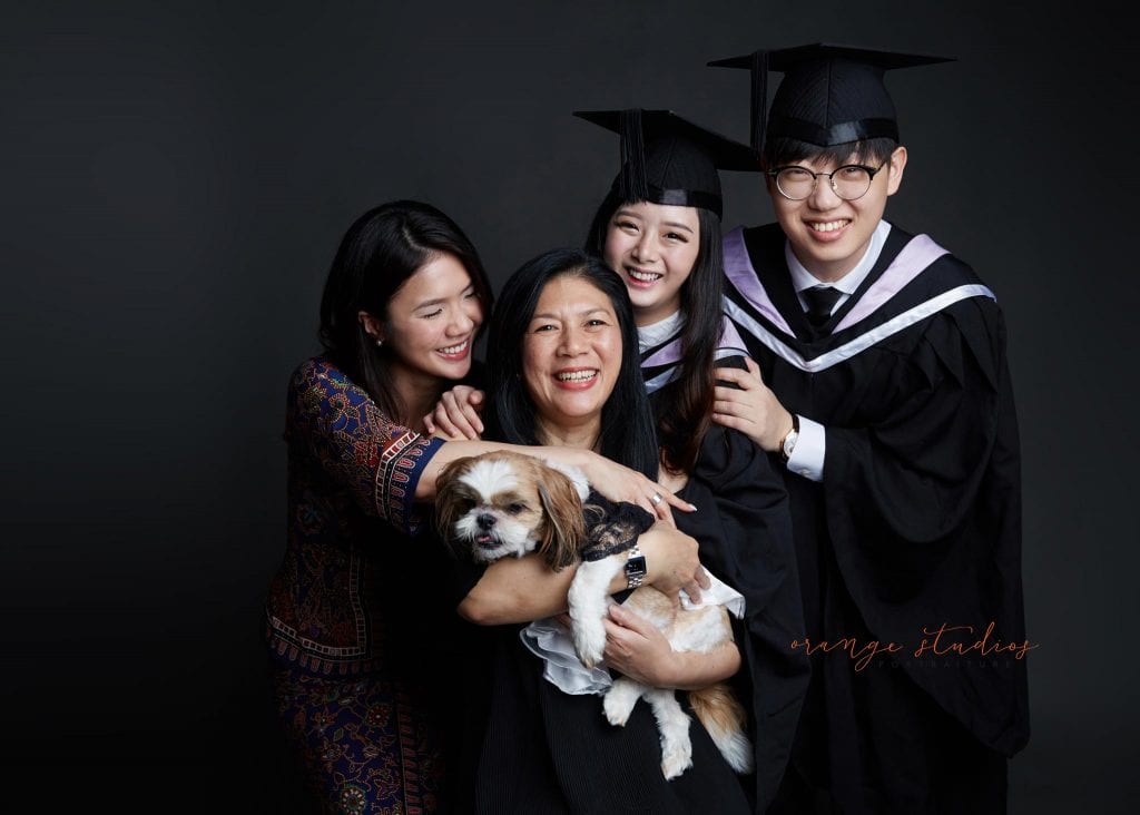 natural and fun graduation family portraits with pet dog in singapore studio