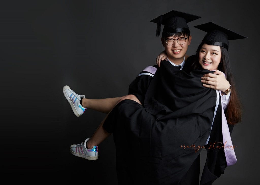 natural and fun graduation couple portraits in singapore studio