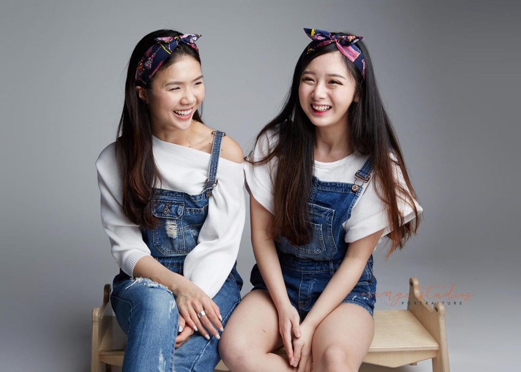 natural and fun sisters family portraits in singapore studio