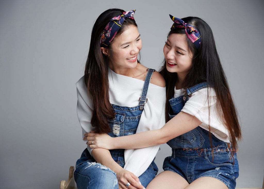 natural and fun sisters family portraits in singapore studio