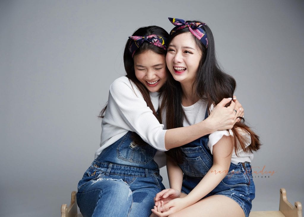 natural and fun sisters family portraits in singapore studio