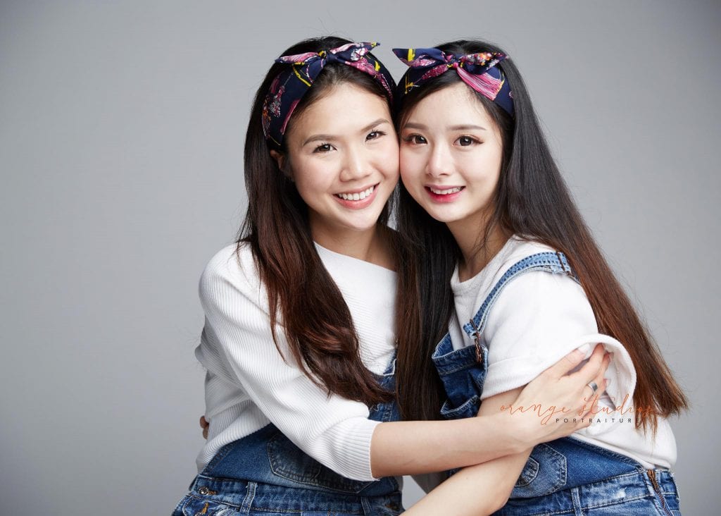 natural and fun sisters family portraits in singapore studio