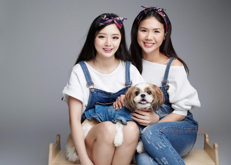 natural and fun sisters family portraits with pet dog in singapore studio