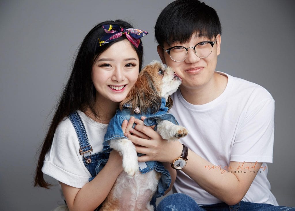 natural and fun couple portraits with pet dog in singapore studio