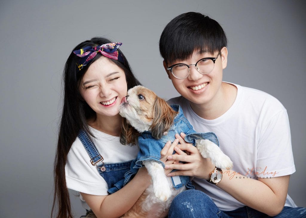 natural and fun couple portraits with pet dog in singapore studio